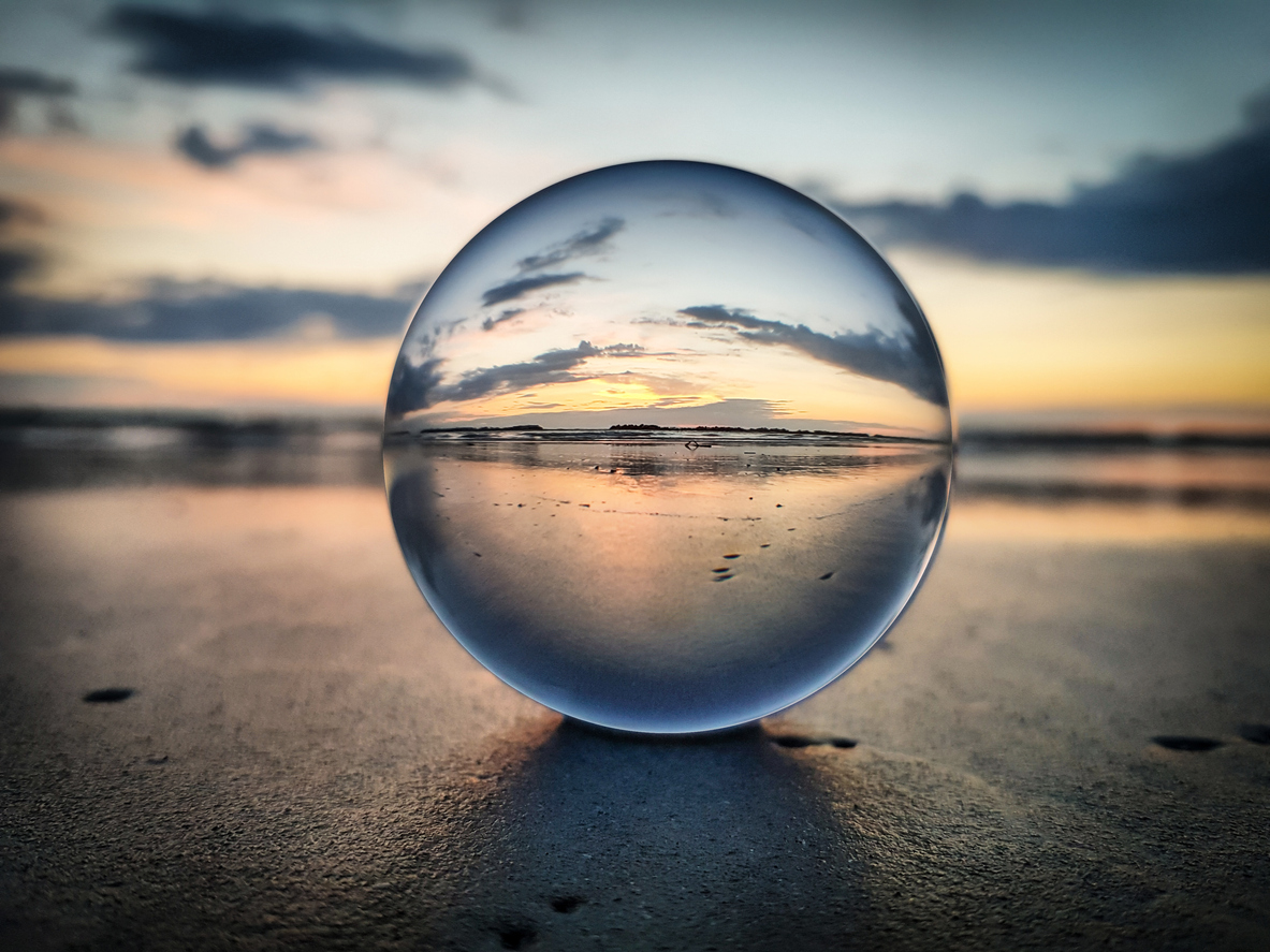 An image of watching sunrise through a lens ball - Riviera Romagnola that represents the word strategy